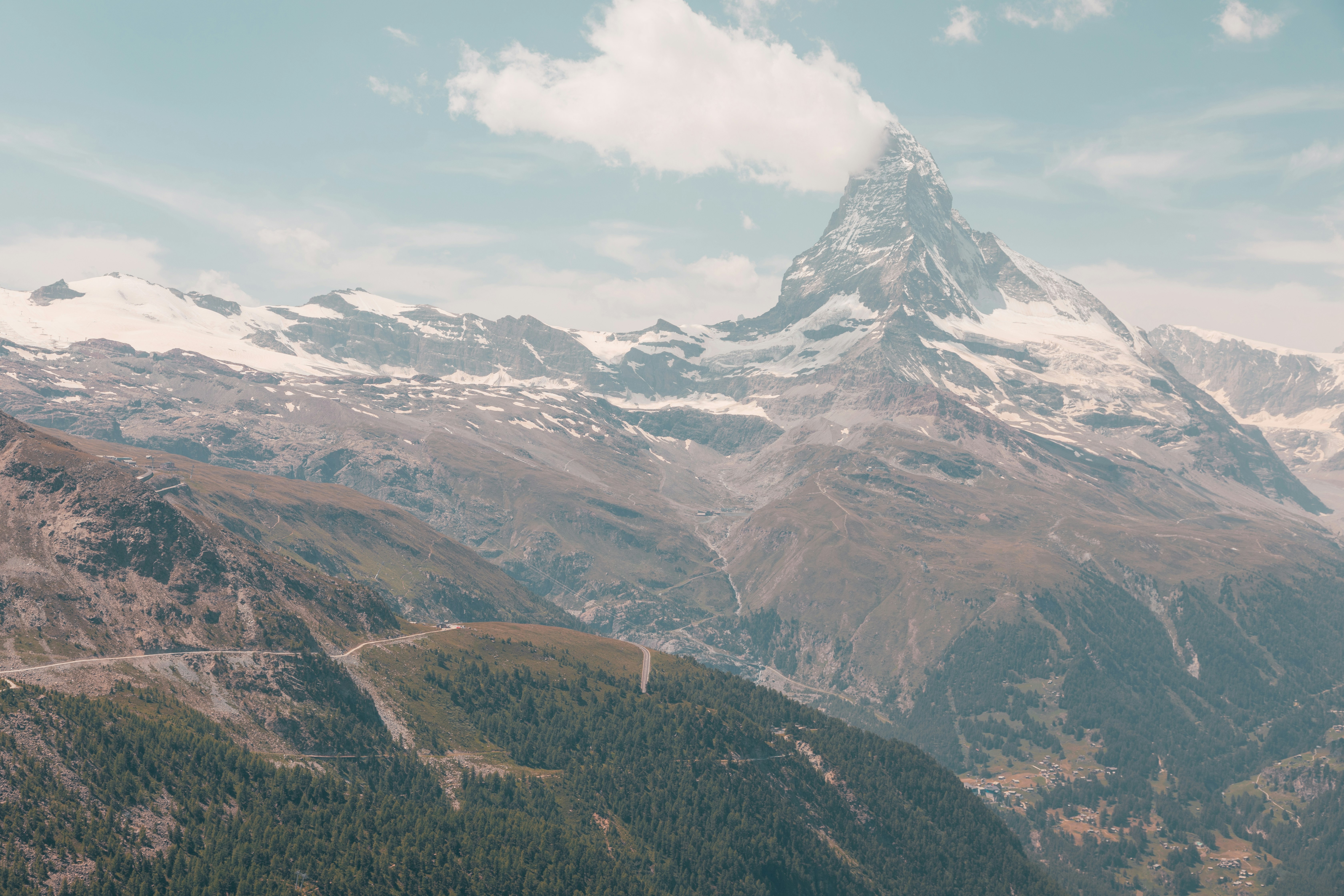 green and brown mountains under white clouds during daytime